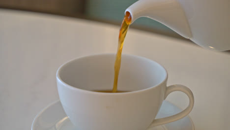 pouring-hot-tea-in-cup
