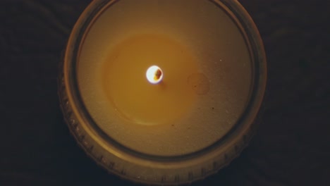 Lighted-Rustic-Aroma-Candle-Inside-Dark-Room