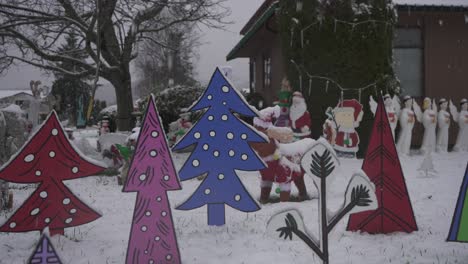 Cartoon-Christmas-lawn-decorations-during-a-light-snowfall-in-Canada