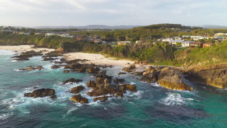 Forster-coastal-town-New-South-Wales-Australia,-aerial-view-of-waves-and-beach