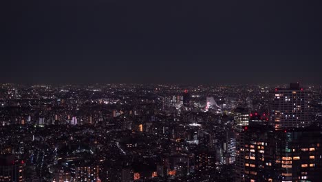 High-above-aerial-night-cityscape-of-Tokyo-suburban-area-with-flickering-lights