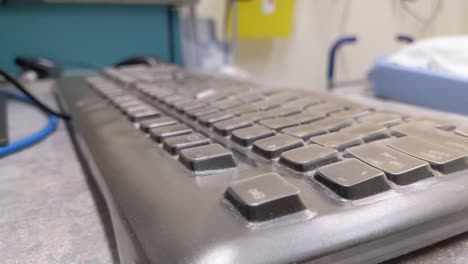 Slow-pan-up-over-keyboard-in-a-hospital-room