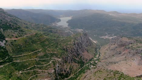 Aerial-epic-shot-of-curvy-or-winding-roads-and-mountains-in-Lasithi