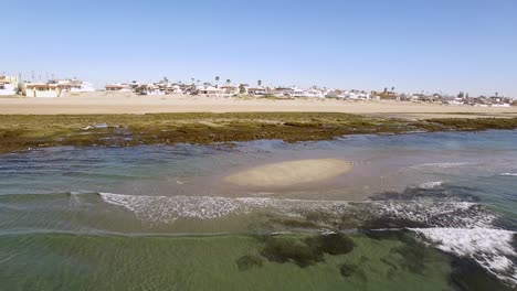 Aerial-pull-back-from-the-intertidal-beach-out-the-open-ocean-Rocky-Point,-Puerto-Peñasco,-Gulf-of-California,-Mexico