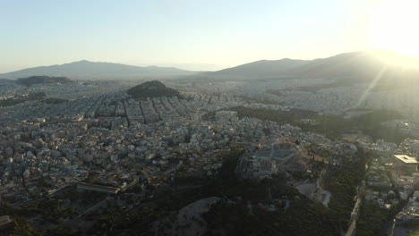Sidewards-moving-drone-aerial-shot-showing-the-city-of-Athens,-Greece
