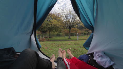 Couple-waking-up-together-in-camping-tent-pov-shot