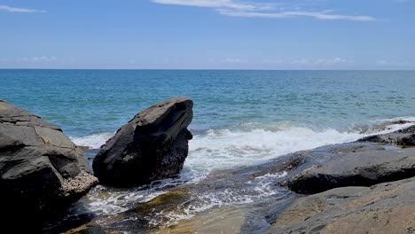 Gentle-Ocean-Surf-Waves-Crashing-Over-Rocks-At-Turtle-Creek-Beach