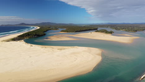 Wide-drone-shot-of-Foster-beach,-the-Nambucca-River-and-ocean-at-Nambucca-Heads-New-South-Wales-Australia