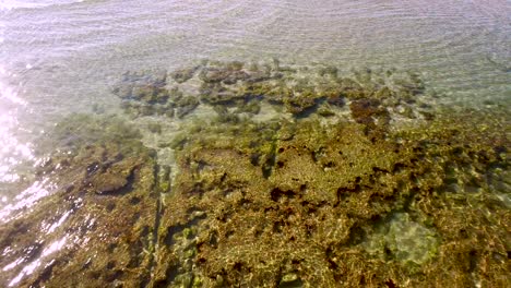 Aerial-tilt-up-and-ascent-over-the-submerged-intertidal-beach,-Rocky-Point,-Puerto-Peñasco,-Gulf-of-California,-Mexico
