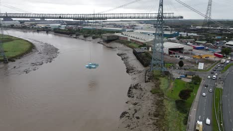 Newport-transporter-crossing-platform-moving-across-river-Usk-waterfront-aerial-tracking-right
