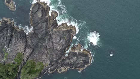 Birds-Eye-Aerial-View,-Rocky-Coaast-and-Pacific-Ocean-Waves-by-Vancouver-Island,-British-Columbia,-Canada