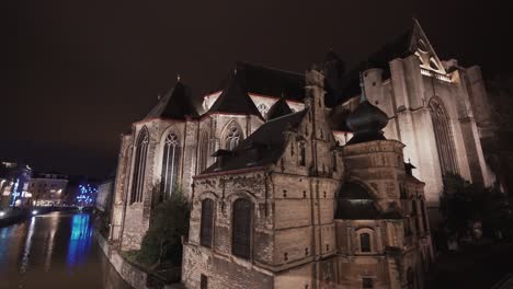 Illuminated-Saint-Michael-church-at-night-in-Ghent,-Belgium
