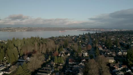 Drone-Flying-Over-Peaceful-Town-With-Seascape-In-Background-At-Proctor-District,-North-End-Tacoma,-Washington