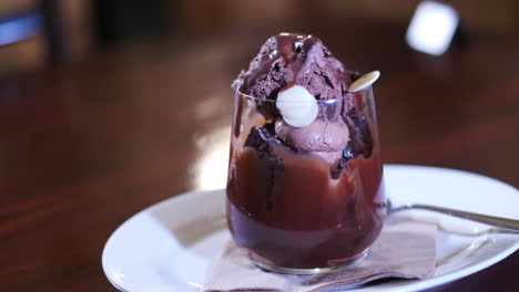 Delicious-glass-cup-of-chocolate-mousse-topped-with-cream-and-choc-chips
