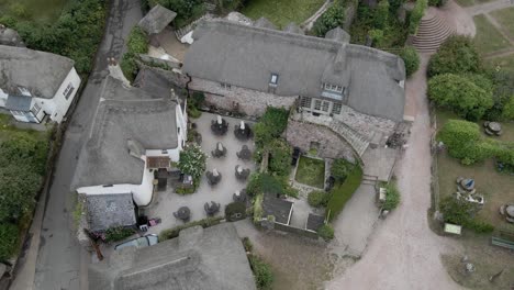 Cockington-Village-thatched-cottage-rural-rooftops-over-English-countryside-public-house