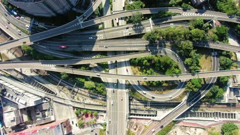Time-lapse-of-a-Massive-Highway-interchange-with-traffic-on-all-levels-in-downtown-Hong-Kong,-Aerial-view