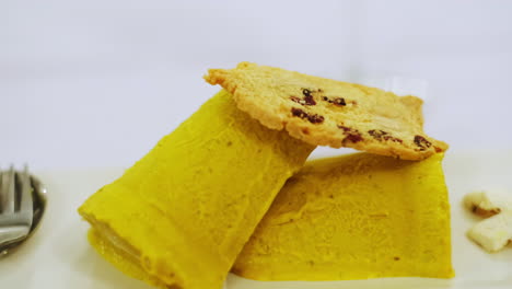 CloseUp-of-dessert-gourmet,-indian-Kulfi-mango-and-pistachio-with-vanilla-and-pistachio-nougat-crumble