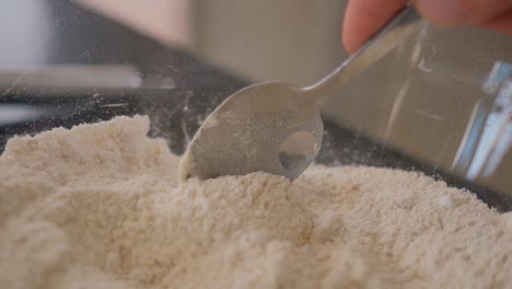 Slow-motion-following-a-spoon-in-a-bowl-of-flour-while-baking