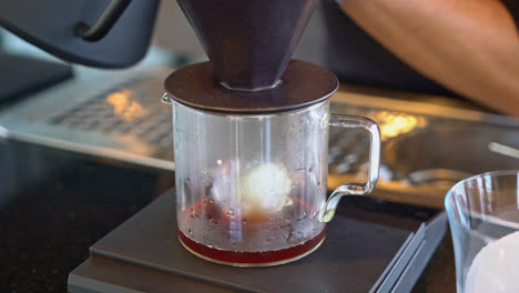 pouring-hot-water-for-dripping-arabica-coffee