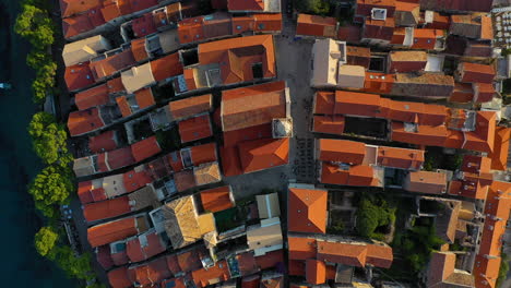 Aerial:-top-down-view-of-Korčula-old-town-rooftops,-Croatian-tourist-destination