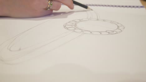 Close-up-designing-a-custom-wedding-ring-sketch-2