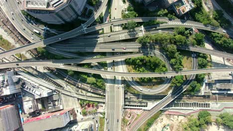 Highway-interchange-with-traffic-on-all-levels-in-downtown-Hong-Kong,-Aerial-view