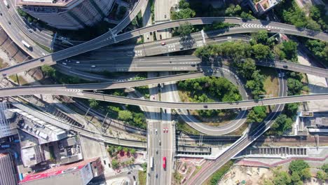 Highway-interchange-with-traffic-on-all-levels-in-downtown-Hong-Kong,-Aerial-view