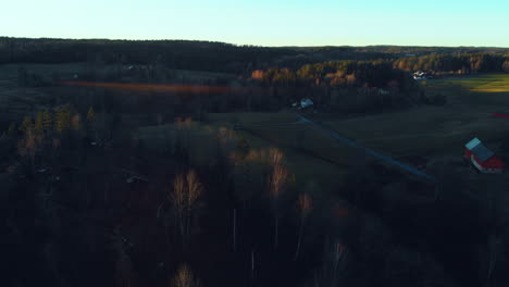 Aerial-view-from-Swedish-late-autum-farm-fields-and-farmhouses