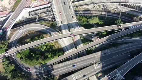 Massive-Highway-interchange-with-traffic-on-all-levels-in-downtown-Hong-Kong,-Aerial-view
