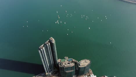 Mega-residential-waterfront-building-complex-in-Hong-Kong-bay,-Aerial-view