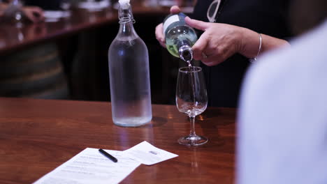 Pouring-a-taste-of-grappa-into-the-glass