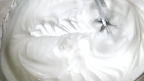 Making-Whipped-Cream-At-Home-For-Baking-With-An-Electric-Hand-Mixer,-close-up