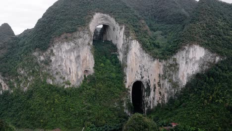 Chinese-karst-mountain,-natural-Great-Arch-of-Getu-Valley,-aerial-view
