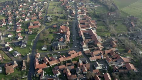Drone-aerial-of-the-typical-german-village-Seeburg-located-at-the-Seeburger-See-on-a-beautiful-Sunday-morning