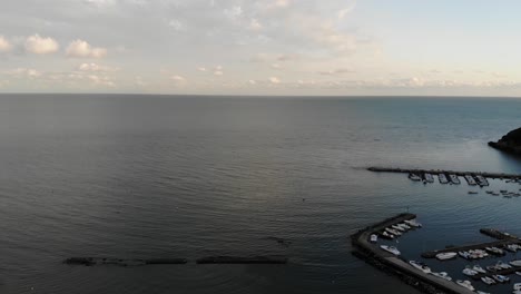 Pull-Back-Drone-shot-at-sunset-sea-Scauri-Marina-di-Minturno-full-HD-50-fps