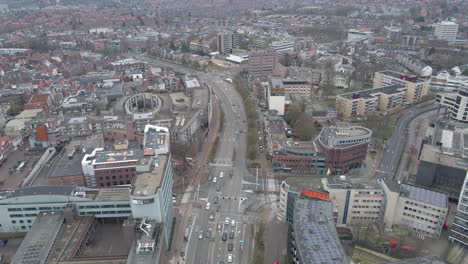 Aerial-of-cars-driving-over-road-through-city-center