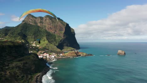 Unforgettable-paragliding-experience-above-scenic-shore-of-Madeira,-aerial