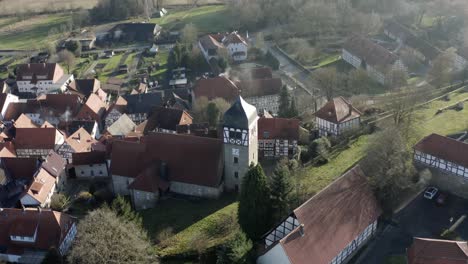 Drone-aerial-view-of-the-fairytale-castle-Adelebsen-on-a-beautiful-autmn-afternoon-in-golden-sunlight