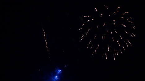 Long-thin-lines-of-light-burst-into-explosions-of-colorful-fireworks