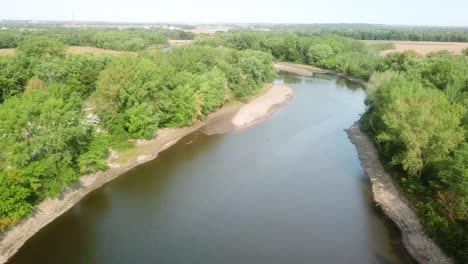 Drone-aerial-view-of-following-bends-in-Iowa-River-water-trail-and-several-large-sandbars-in-the-river