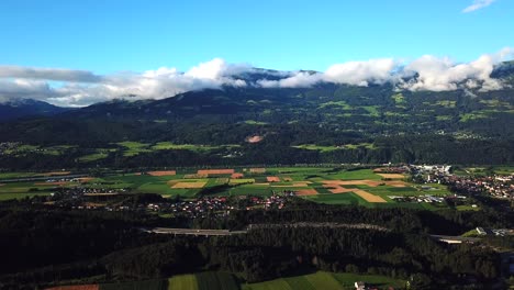Aerial-view-above-Paternion,-Austria,-with-mountains-in-the-background
