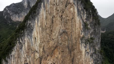 Karst-mountain-rock-face,-rock-climbing-in-rural-China,-Getu-Valley,-aerial