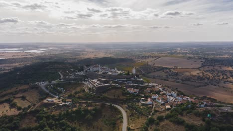 4K-Aerial-Hyperlapse-into-the-medieval-village-of-Monsaraz,-Portugal-in-a-cloudy-day.