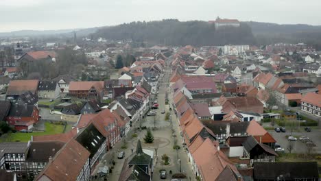 Drone-Aerial-view-of-the-traditional-german-village-Herzberg-am-Harz-in-the-famous-national-park-in-central-Germany-on-a-cloudy-day-in-winter.
