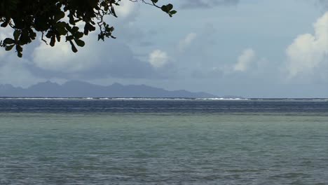 Waves-breaking-in-the-coral-reef-from-Raiatea,-French-Polynesia