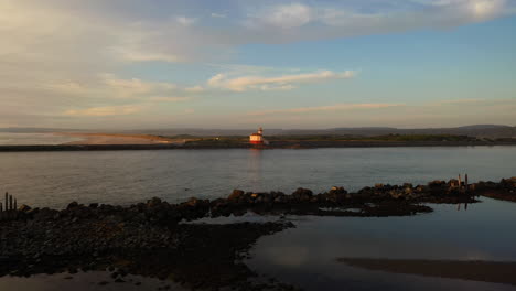 Coquille-River-Lighthouse-In-Bandon,-Oregon-With-Calm-River-Flowing-On-Foreground---wide-static-shot