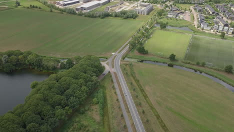 Aerial-drone-shot-of-flying-back-over-the-busy-road-in-the-Netherlands