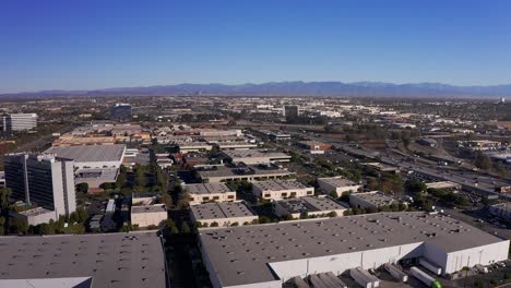 Wide-aerial-rising-shot-of-the-110-Freeway-with-Downtown-Los-Angeles-in-the-far-distance