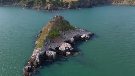 Thatcher-Rock-Island-on-United-Kingdom-Coast,-Aerial-Orbit