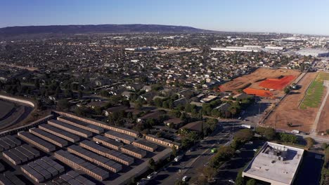 Aerial-descending-and-panning-shot-of-an-industrial-South-Bay-community